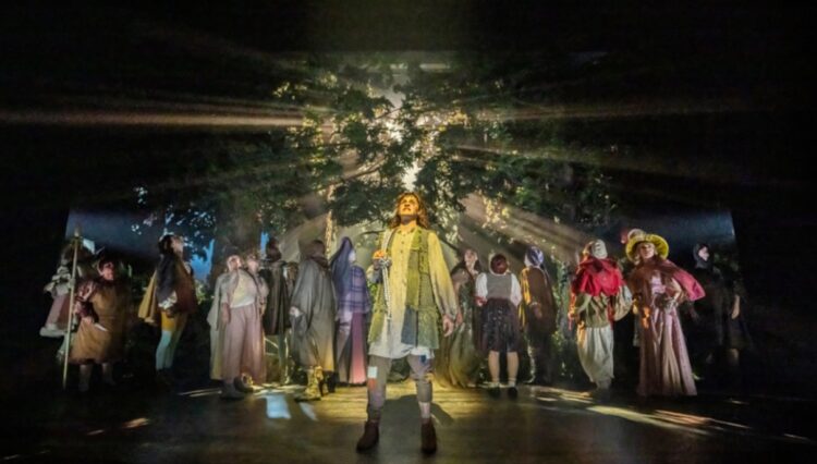 Ensemble on the forest stage in Into the Woods