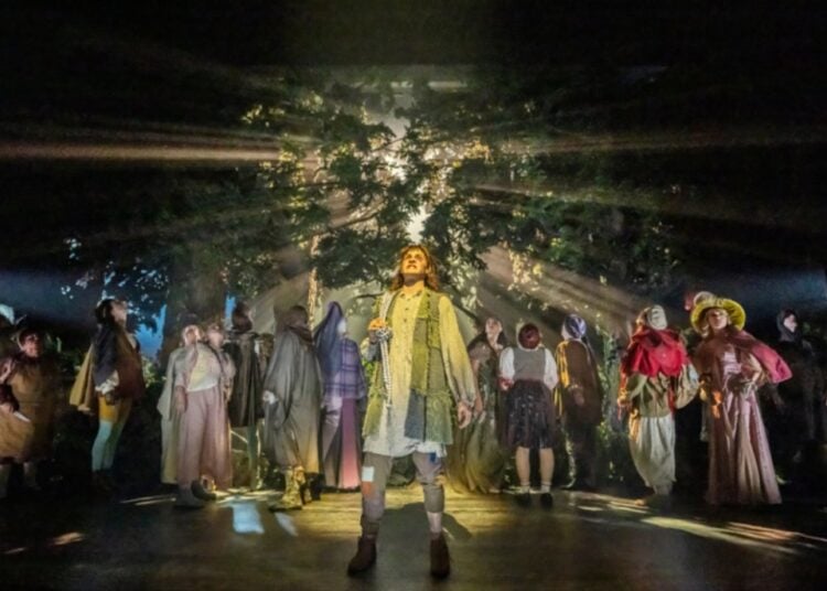 Ensemble on the forest stage in Into the Woods