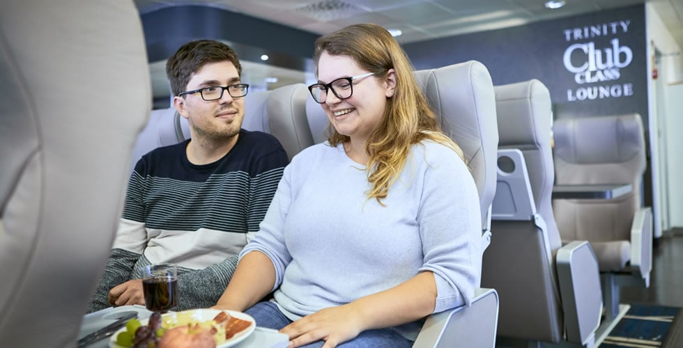 Couple relaxing in Club Class aboard Irish Ferries Dublin Swift