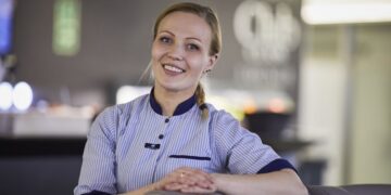 Smiling ferry crew member aboard Dublin Swift