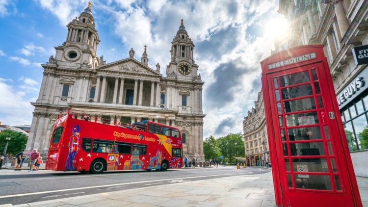 Bright red City Sightseeing bus touring London