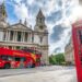 Bright red City Sightseeing bus touring London