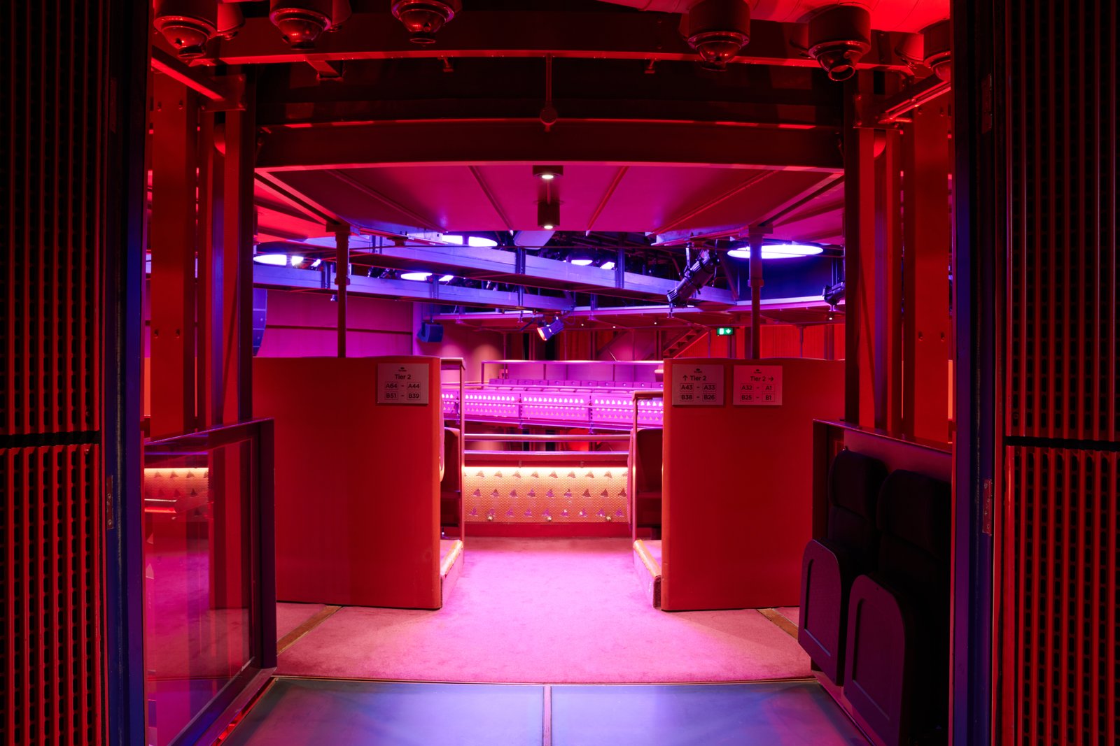 Lowry theatre auditorium lit in red and purple
