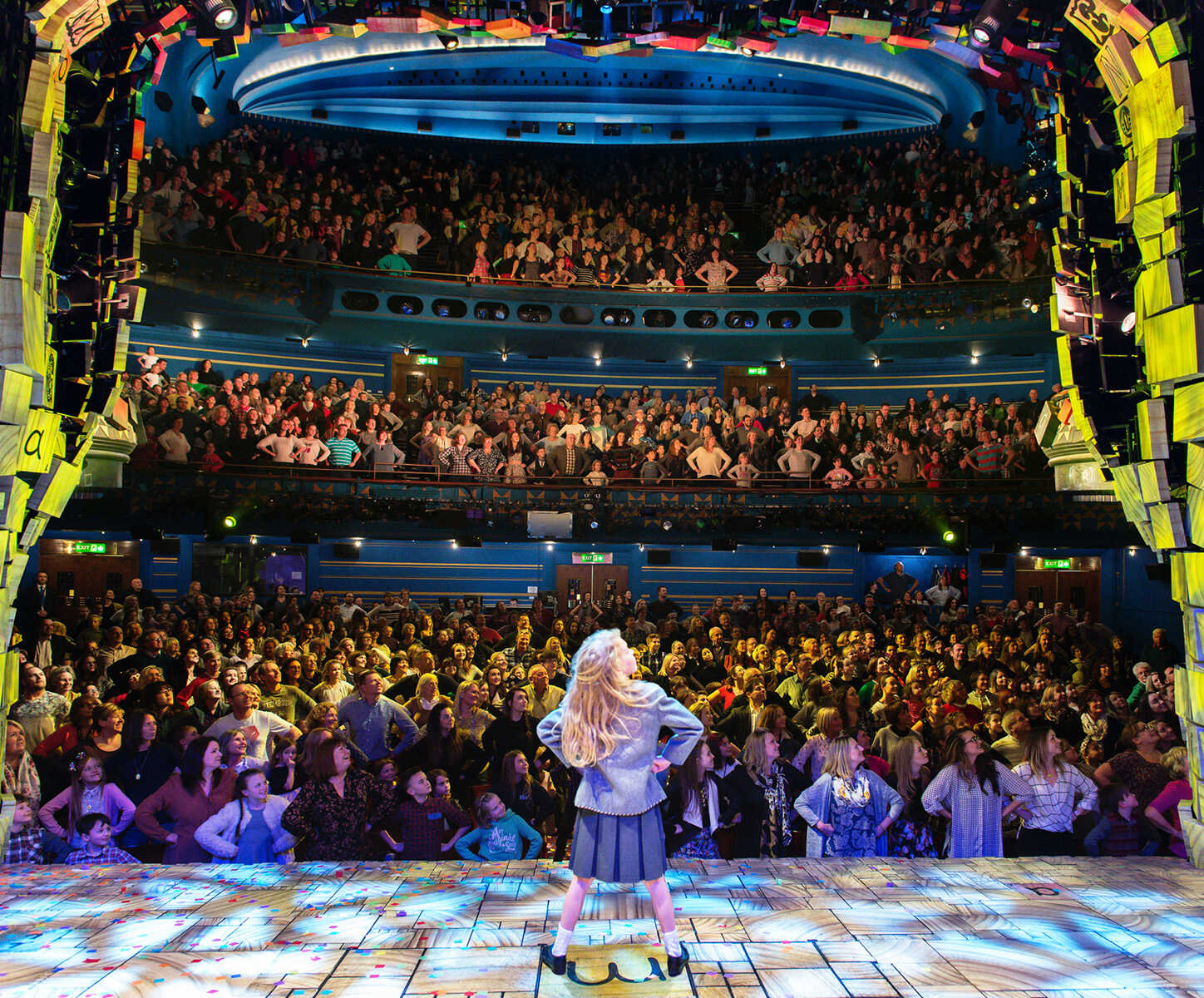 Matilda The Musical performers posing with the audience