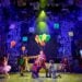 Matilda and the cast performing on the Cambridge Theatre stage