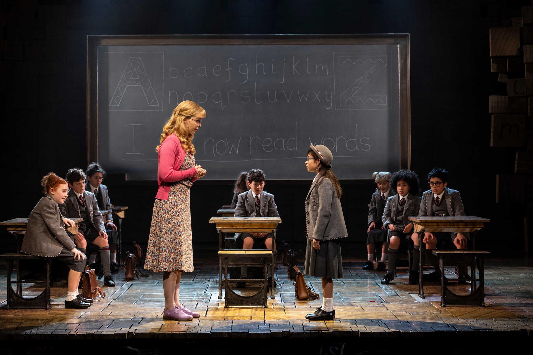 Matilda The Musical ensemble performing on stage