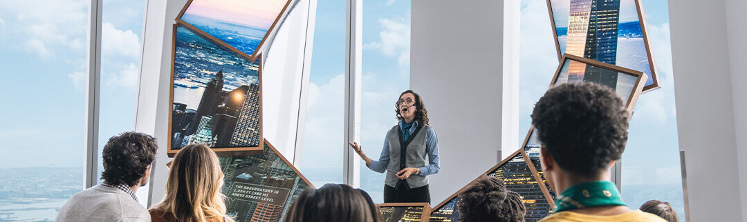 Visitors engaging with the City Pulse experience at One World Observatory