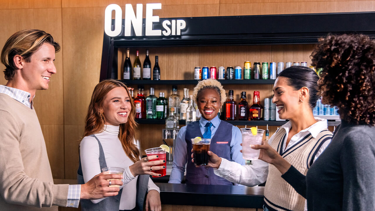Guests enjoying drinks during happy hour at ONE Dine