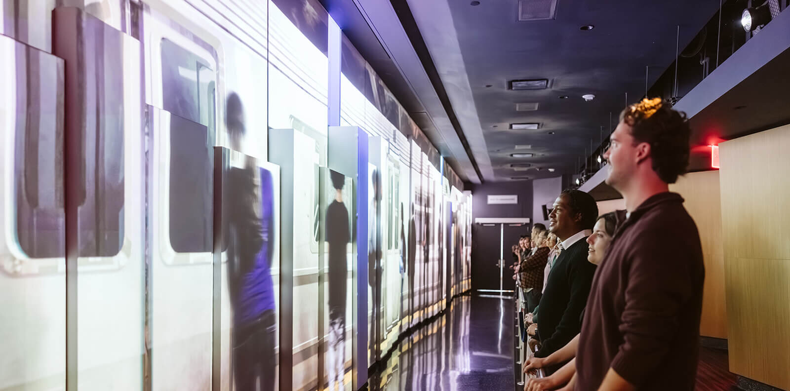 Guests inside the See Forever Theater at One World Observatory