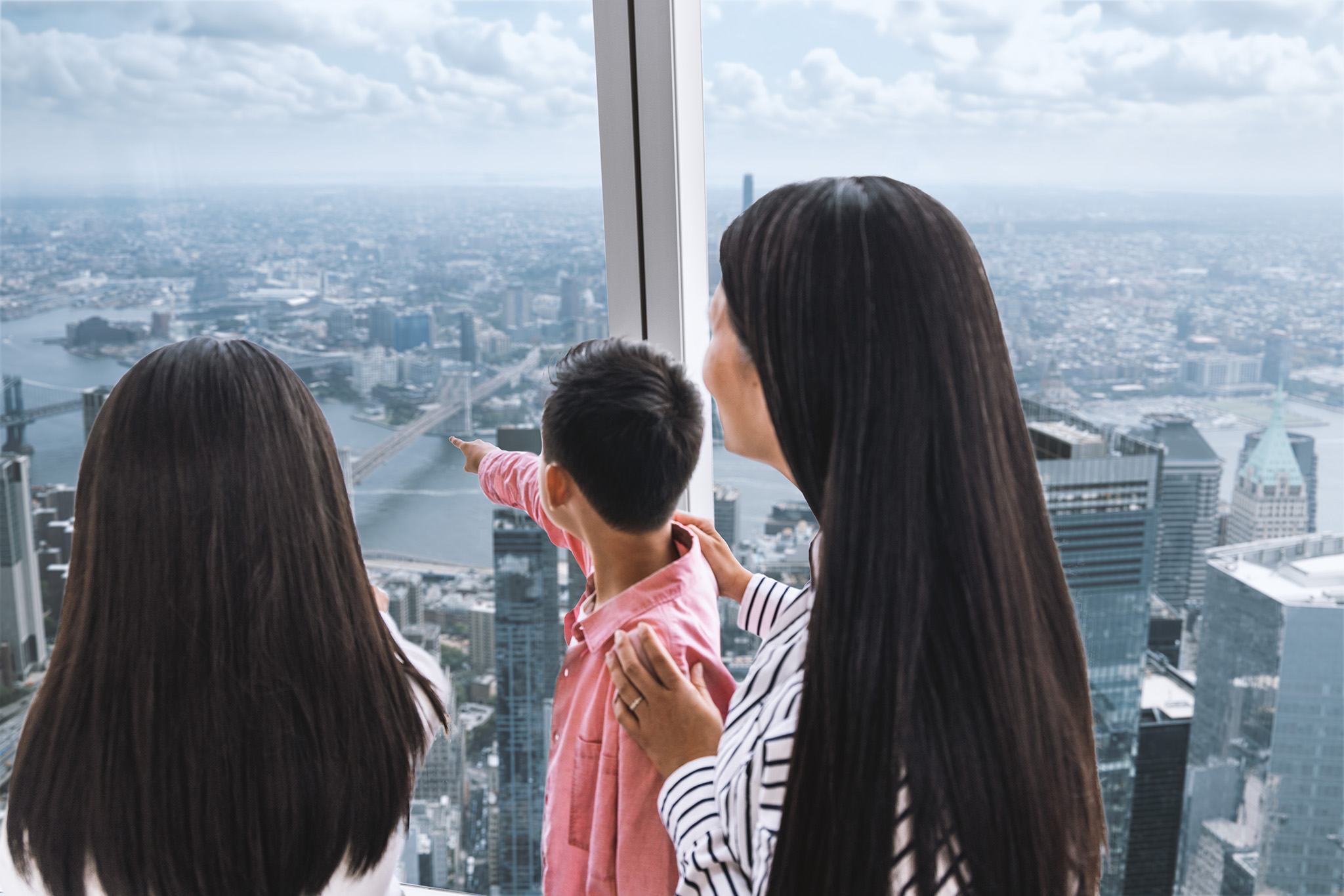 Family looking across the South view from One World Observatory