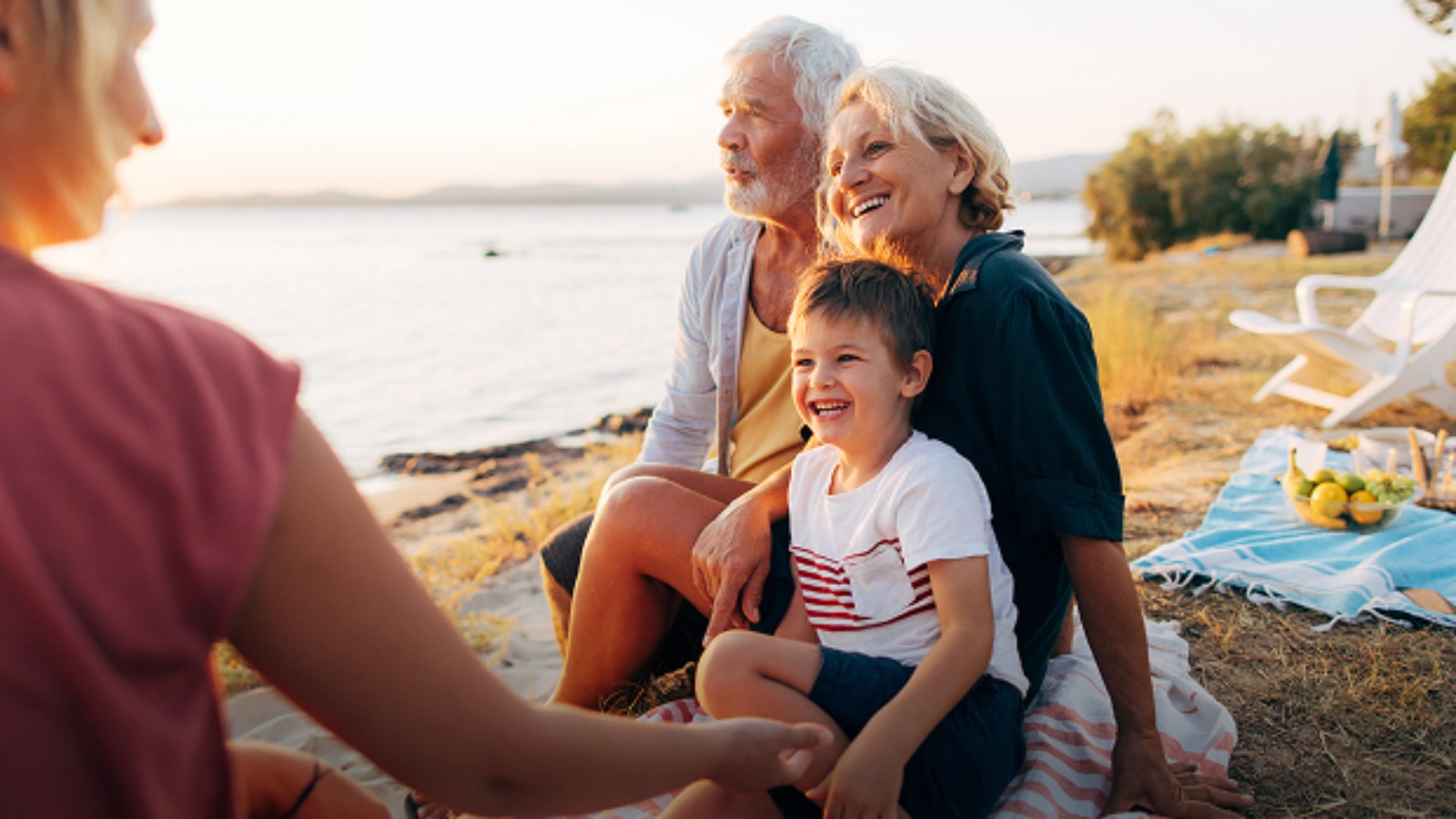 Family posing beside the seaside