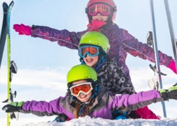 Traveller enjoying a winter sports holiday in snow-covered mountains
