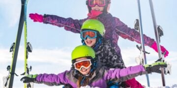 Traveller enjoying a winter sports holiday in snow-covered mountains