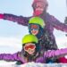 Traveller enjoying a winter sports holiday in snow-covered mountains