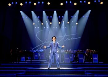 Performers from Sinatra the Musical on stage in a dramatic West End scene