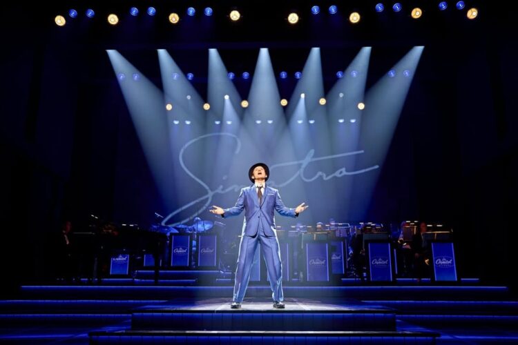 Performers from Sinatra the Musical on stage in a dramatic West End scene