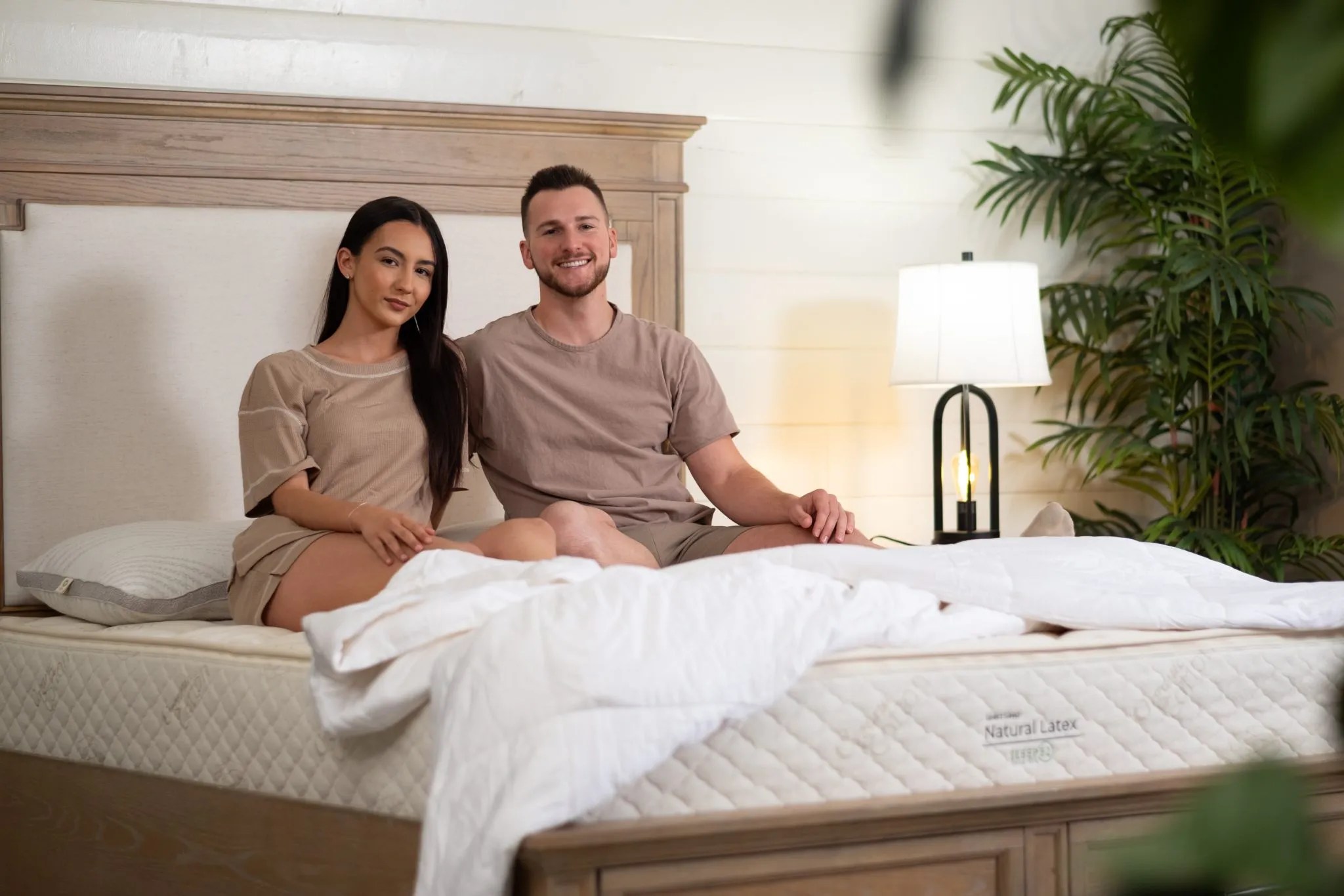 100% natural latex mattress displayed on a bed