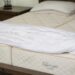 Organic latex mattress shown in a bright bedroom