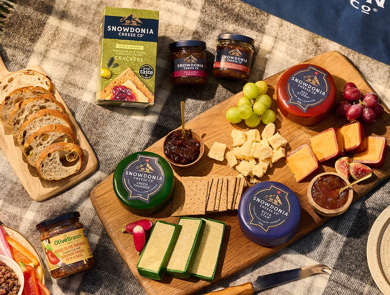Close view of cheese and picnic hamper items ready to serve