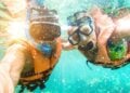 Couple taking a selfie in a tropical sea