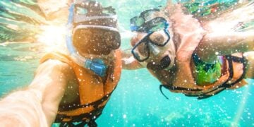Couple taking a selfie in a tropical sea