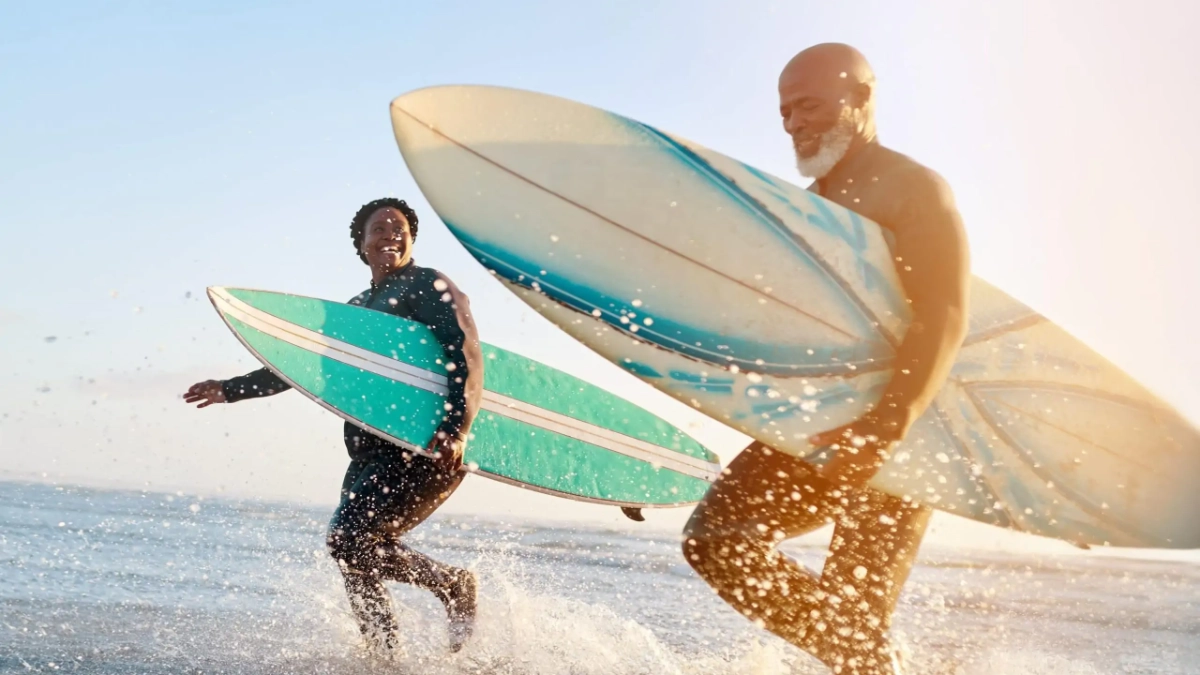 Mature couple enjoying a surfing holiday