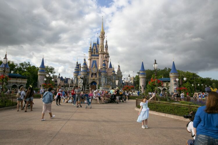Visitors gathering in front of Cinderella Castle at Magic Kingdom