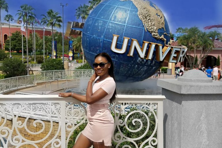 Visitor beside the Universal Orlando entrance globe