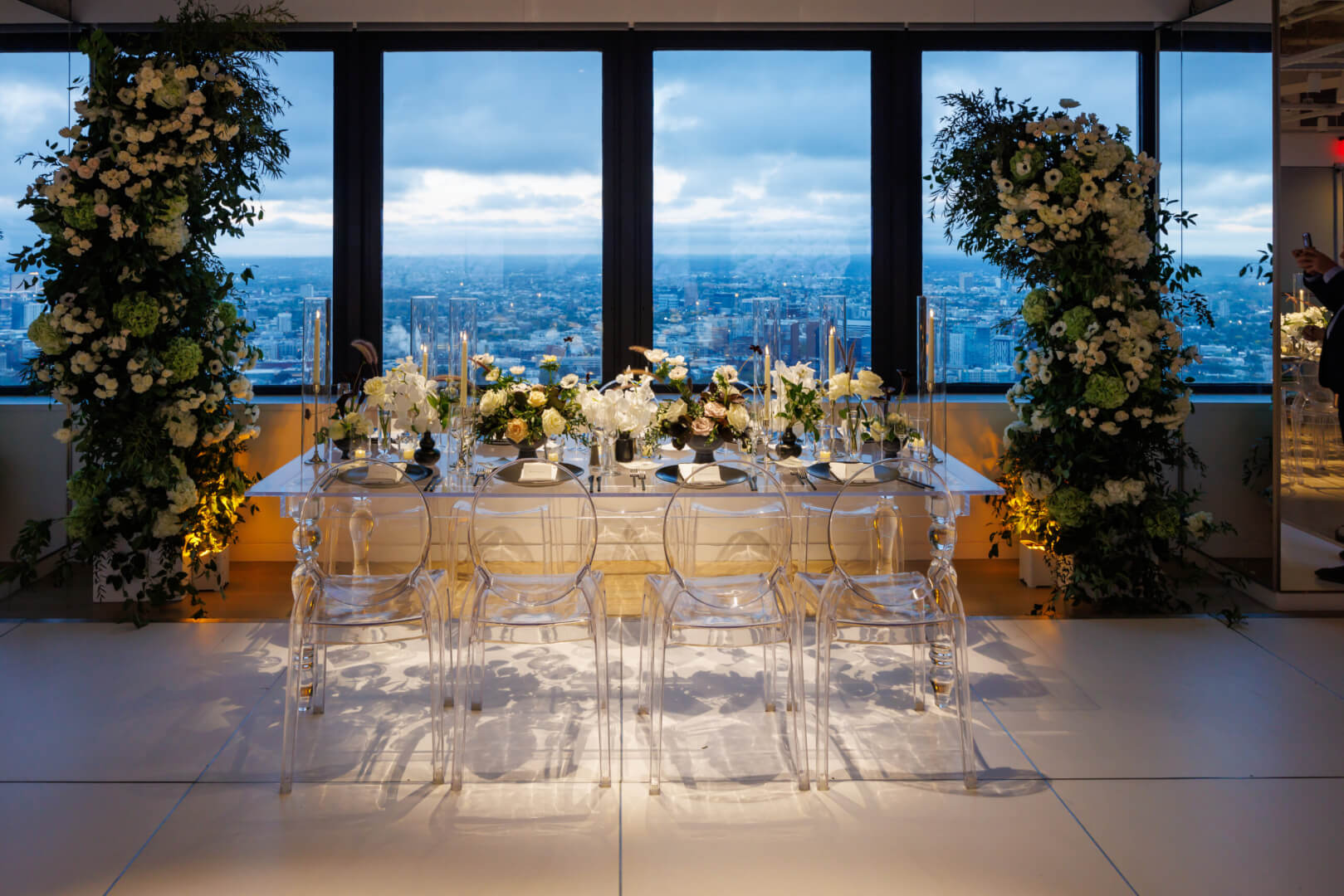 Event setup with floral decor and Boston skyline views at View Boston