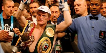 Boxer celebrating with championship belts in a Zapply campaign image