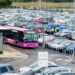Airport parking shuttle moving through a car park