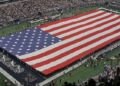 A view of the field and flag at AT&T Stadium