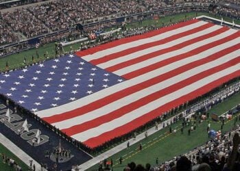 A view of the field and flag at AT&T Stadium