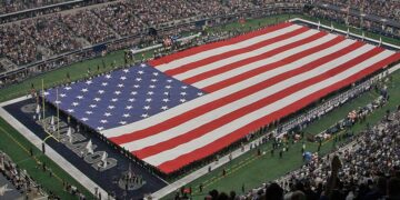 A view of the field and flag at AT&T Stadium