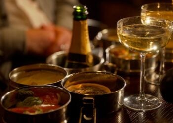 Food and drinks arranged on a table at the Kit Kat Club