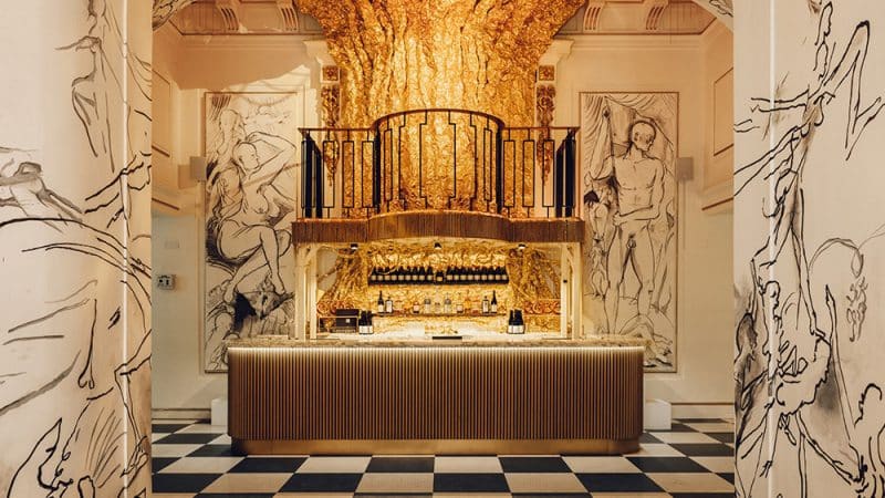 An ornate bar interior at the Kit Kat Club