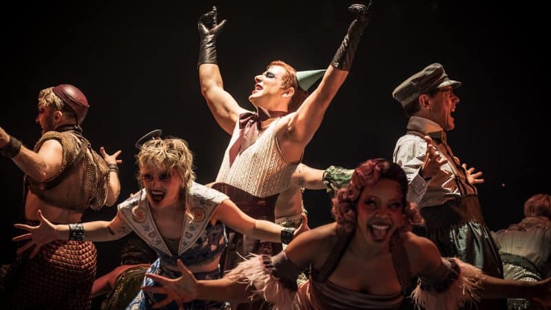 Cabaret performers sharing a scene on stage
