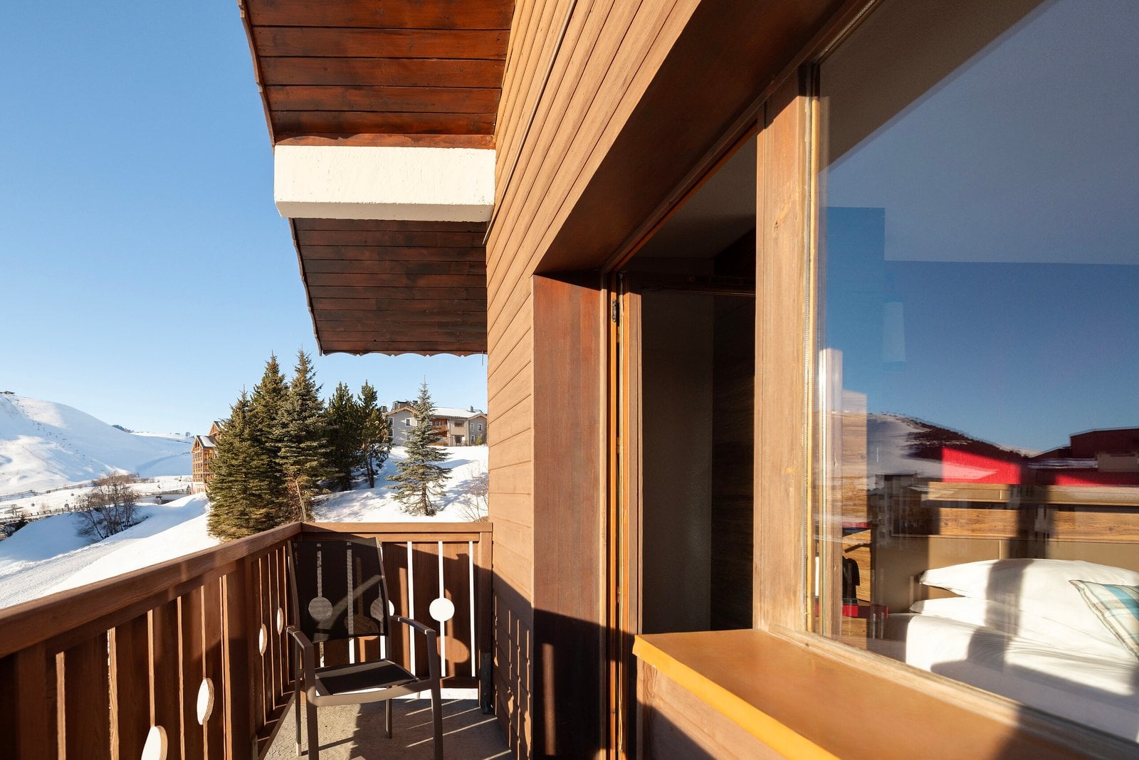 Mountain-inspired Superior room with alpine wood and bright fabrics