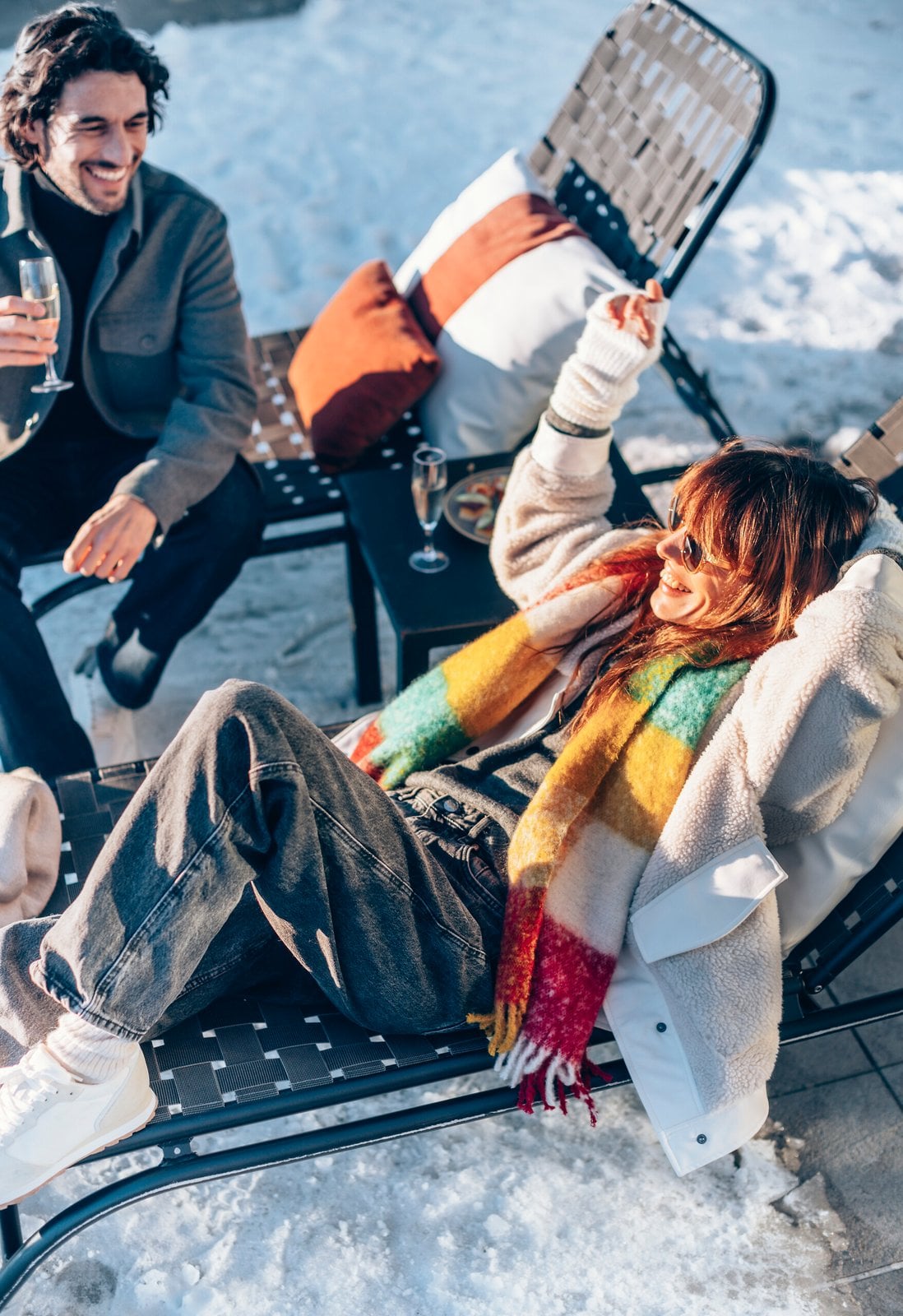 Guests relaxing together outdoors in the snow