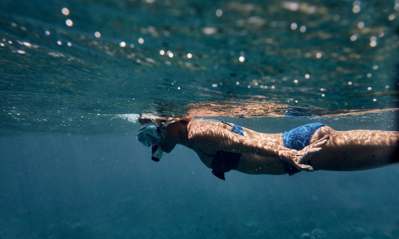 A swimmer in clear resort waters