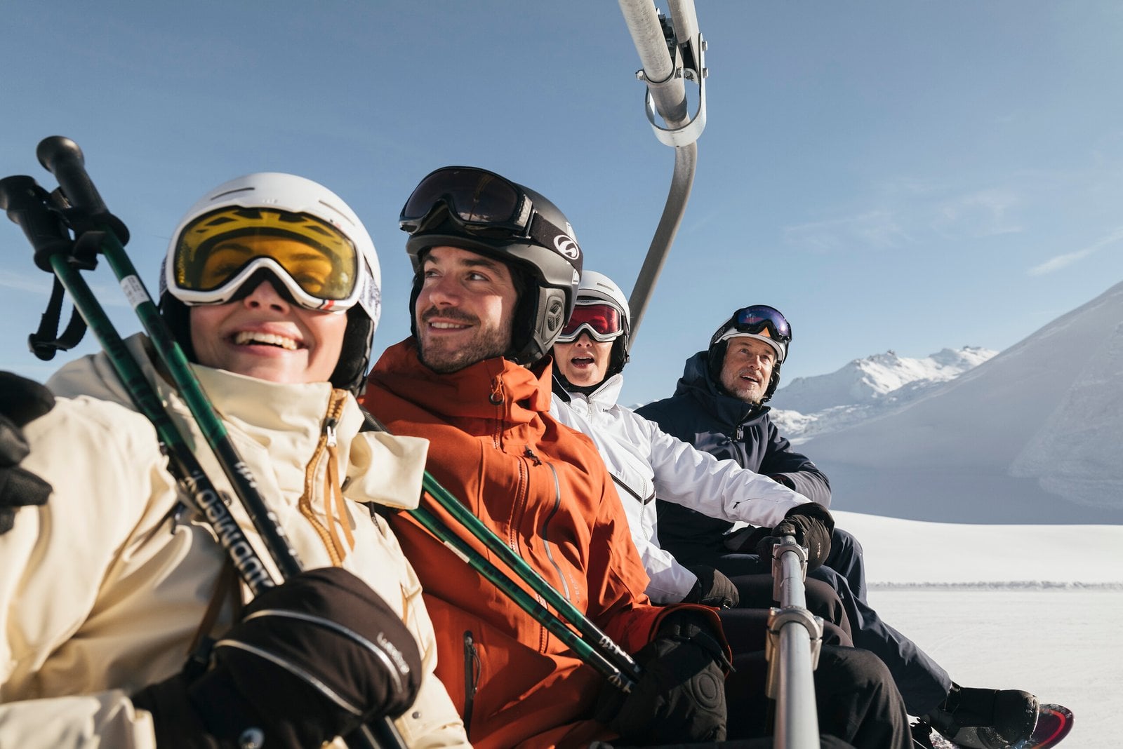 Group of skiers riding a chairlift