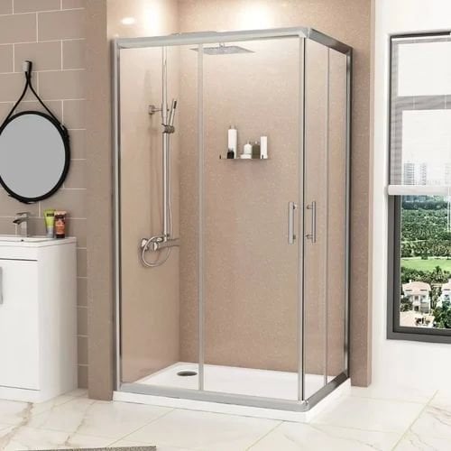 Chrome-framed sliding shower cubicle in a beige bathroom