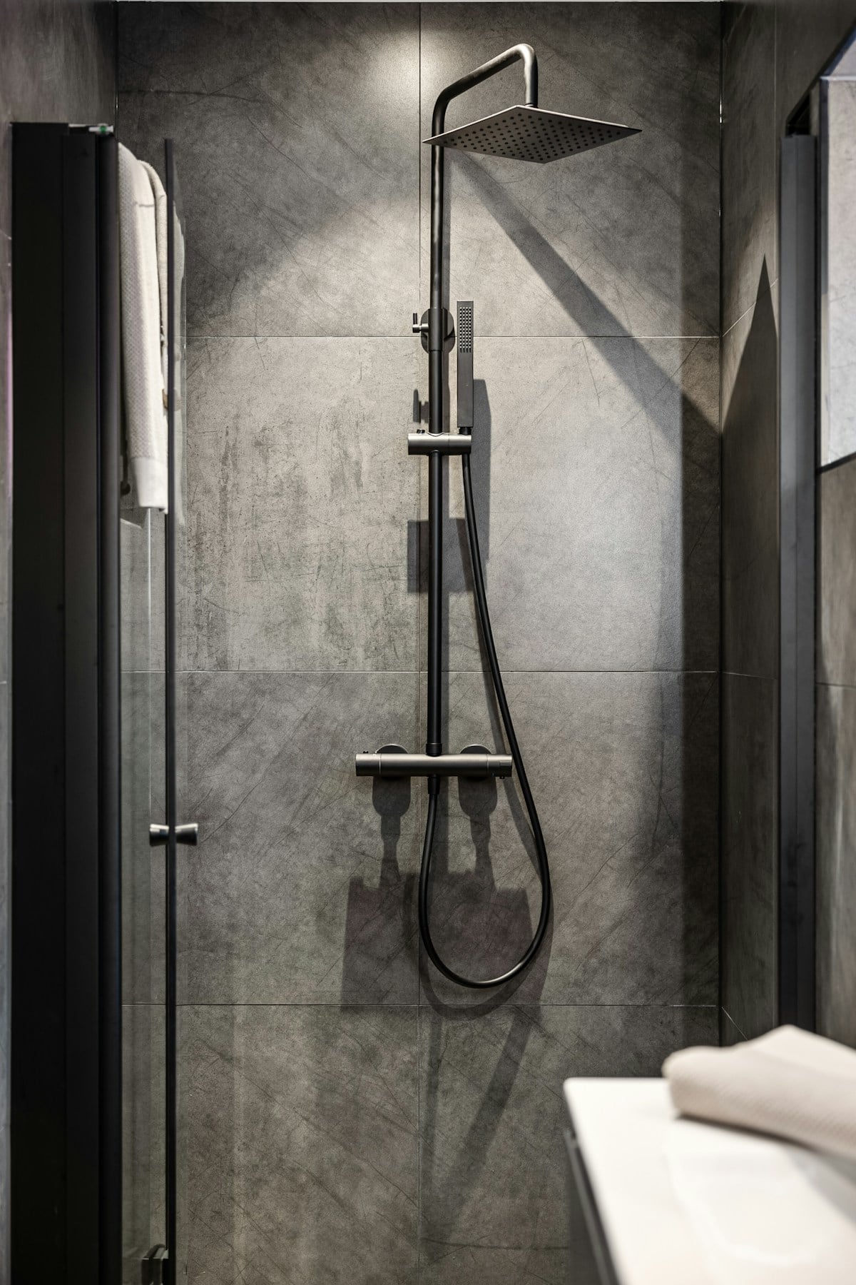 Walk-in shower in a light modern bathroom