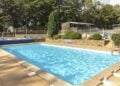 Outdoor swimming pool at Chateau Lez Eaux campsite