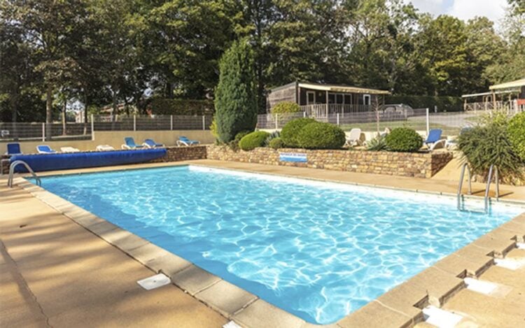 Outdoor swimming pool at Chateau Lez Eaux campsite