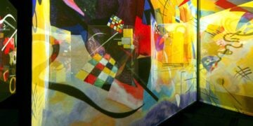 Visitors inside a colourful Frameless gallery installation