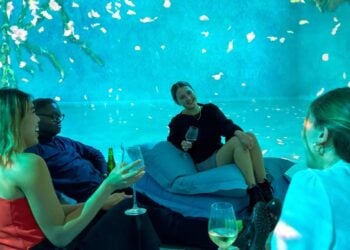 Visitors enjoying an after-hours Frameless Lates session