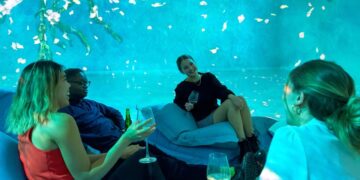 Visitors enjoying an after-hours Frameless Lates session