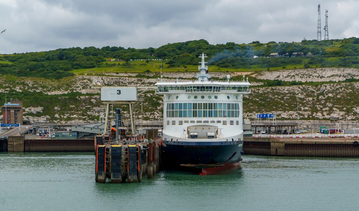 Ferry alongside a port with its vehicle ramp lowered