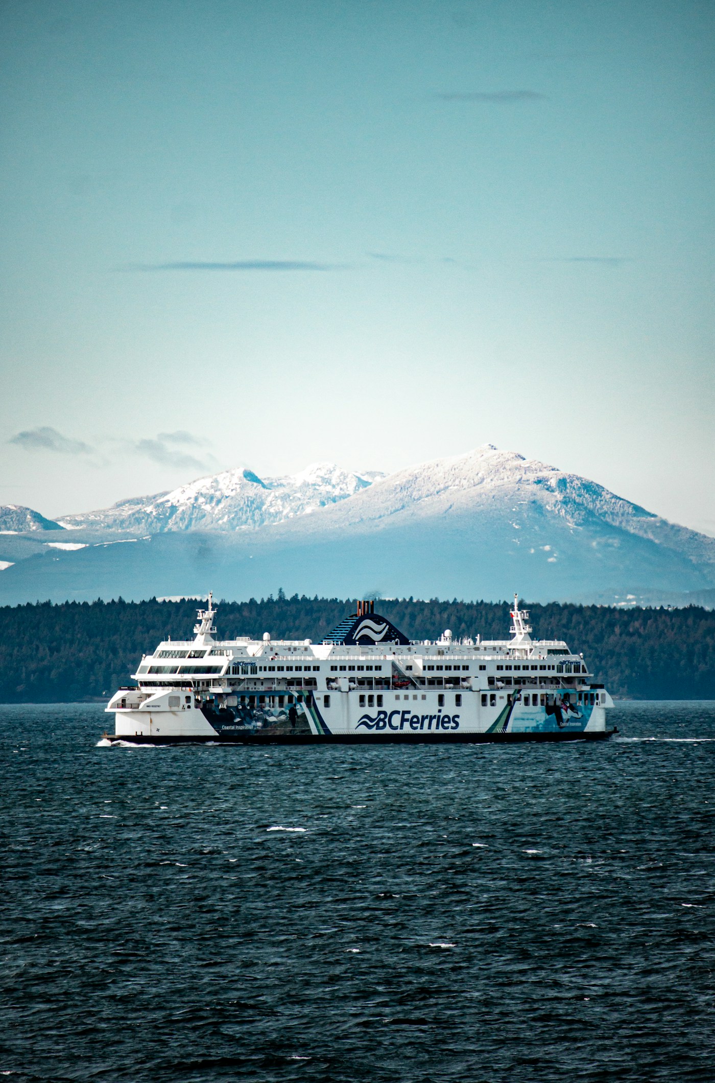White ferry travelling across calm water